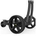 A black wheeled cart with sleek, star-shaped wheels is positioned at an angle showcasing its robust design and structure ready for movement on a smooth surface.