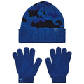 A blue beanie with a camouflage pattern sits above a pair of matching blue gloves both designed for warmth in cold weather displaying an Under Armour logo on them