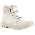 A beige canvas boot features a foldable collar and laces with metal eyelets positioned on a textured rubber sole visible against a plain light background