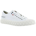 White canvas sneaker with multiple eyelets and a thick textured sole sits on a plain background showcasing its design details and subtle color accents near the heel.