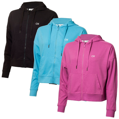 Three zip-up hoodies are displayed in a row featuring black blue and pink colors with the letters CK on the left chest area suggesting a brand identity in a retail context.