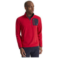 A man is wearing a bright red fleece pullover with a zippered navy chest pocket displaying a logo while looking slightly off to the side in a neutral background