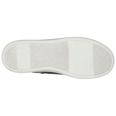 A shoe sole with a textured design featuring floral patterns rests flat on a surface showcasing intricate details and a clean white background emphasizing the shoe's structure.