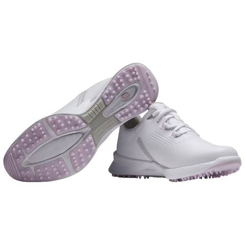 A pair of white athletic shoes is displayed with a focus on the soles featuring textured rubber grips and a sleek design suitable for sports or outdoor activities in a neutral background.