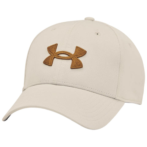 A beige baseball cap features a prominently stitched brown Under Armour logo on the front. It is designed for casual wear and outdoor activities in various environments.