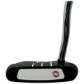 A golf putter with a black and white design rests upright with a shiny chrome shaft visible it is designed for hitting a golf ball on a putting green.