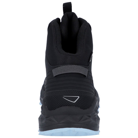 A black athletic shoe stands upright showcasing its rear design with textured materials and a reflective logo on the side while a rubber sole features a distinct tread pattern.