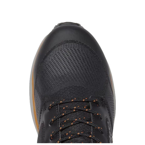 A black athletic shoe is prominently displayed with a textured surface and orange accents while the laces are tightly secured suggesting readiness for activity.