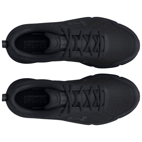 Two black athletic shoes are displayed with their tops facing up laces neatly tied showcasing a textured surface and a logo with the text COMFORT DELUXE SYSTEM visible inside the shoes.