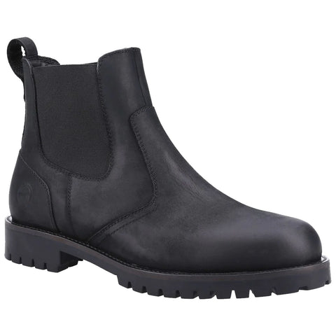 Black leather Chelsea boot stands upright showcasing its smooth surface elastic side panels and rugged tread sole suitable for casual or semi-formal wear in various environments.