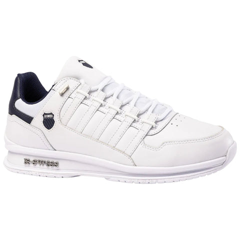 A white athletic shoe with a textured design on the side and dark blue accents is positioned upright showcasing its laces and logo in a neutral setting ideal for sports.