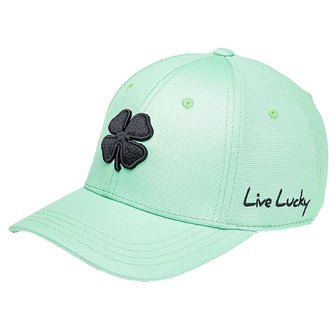 A light green baseball cap features a black four-leaf clover emblem and the text Live Lucky embroidered on the side, designed for casual wear or outdoor activities.