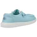 Aquamarine shoe with a soft fabric upper rests on a white speckled sole showcasing a relaxed style suitable for casual wear in outdoor settings.