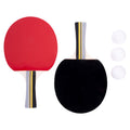 Two table tennis paddles one red and one black sit side by side accompanied by three white ping pong balls all against a plain background