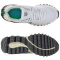 A sneaker features a white upper with gray accents and a textured black sole resting on a flat surface. It showcases a green insole and is designed for athletic use.