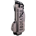 A golf bag is standing upright showcasing its sleek design and compartments for clubs and accessories the surface is a light color with the word ENDEAVOR prominently displayed