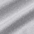 A patterned fabric features wavy and irregular line designs in black on a white background creating a textured appearance with shadows highlighting the contours and folds of the material.