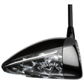 A golf driver is shown positioned at an angle ready for use featuring a sleek black and silver design with a Callaway logo prominent on one side.