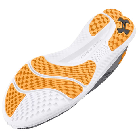 A white and orange athletic shoe sole is displayed with a textured design for grip. It is oriented upwards to showcase its patterns and materials without a surrounding context.