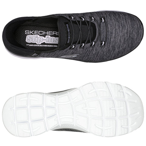 Sport shoes are displayed showcasing a lightweight black and gray design featuring a textured upper and white sole with grooves positioned for flexibility in a neutral background.