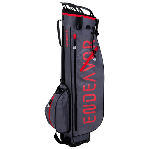 A tall gray golf bag stands upright featuring red accents and the word "ENDEAVOR" prominently displayed. It has multiple pockets and a zippered top, ready for golf equipment.