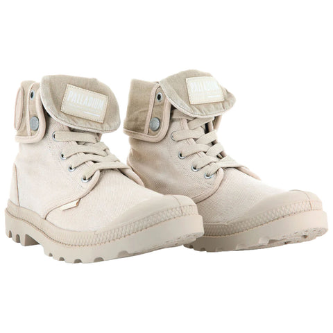 Beige canvas boots with a high top design feature lace-up closures and a foldable padded collar. They are set against a white background with no additional context provided.