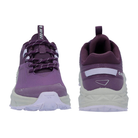 Purple athletic shoes are displayed upright showcasing a textured surface and laces the shoes have a white sole and a back pull tab indicating a focus on functionality in outdoor activities.