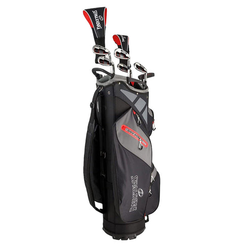 A black and gray golf bag stands upright holding several golf clubs with red accents showcasing the brand Spalding in a simple and organized manner suitable for carrying during a game