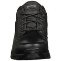 A black shoe is centered prominently featuring laces and a textured surface made of leather and synthetic material designed for durability and comfort against an undefined neutral background.