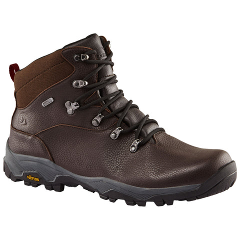 Brown hiking boot with a textured leather upper is displayed prominently laced tightly fronts facing upward showcasing metallic eyelets and a rugged Vibram sole designed for traction in outdoor settings.