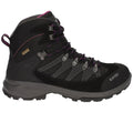 A black hiking boot features a high-top design with purple accents and metal eyelets. It is positioned upright against a neutral background showcasing its durable construction for outdoor activities.