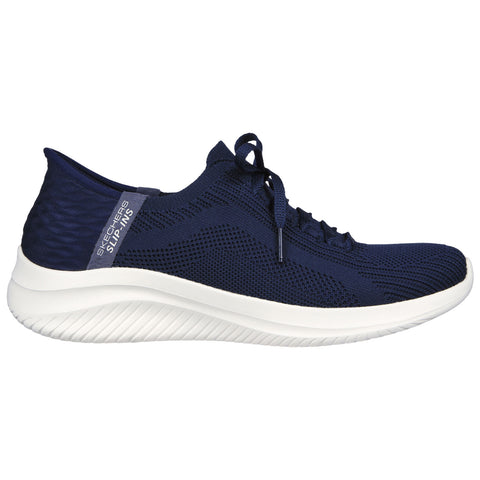 A navy blue sneaker with a textured design features laces and a thick white sole is displayed against a plain background. It is designed for casual wear and comfort.