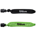 Two wrist straps are displayed side by side. The black strap, featuring white "Wilson" text, is on top, while the green strap, featuring black "Wilson" text, is on the bottom.