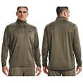 Under Armour Mens Armour Fleece Half Zip 1357145 A man is wearing a green athletic pullover with a high collar and a half zipper. He stands in a neutral space showcasing both front and back views of the garment.