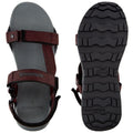 A pair of outdoor sandals with adjustable straps is displayed on a neutral surface showcasing the textured rubber sole and cushioned footbed designed for comfort and traction during activities.