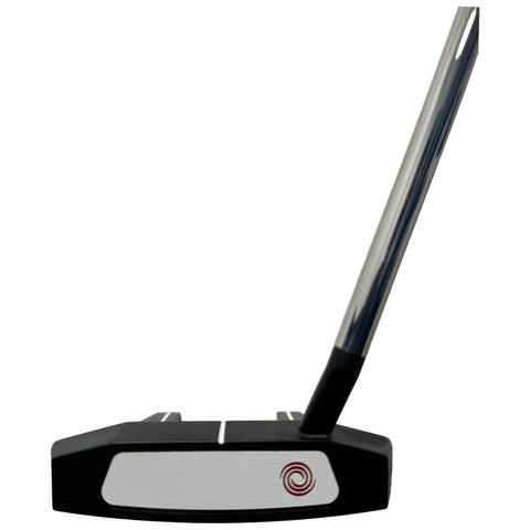 A black and silver golf putter stands upright showing its flat face and distinct markings while resting on a plain white background emphasizing its design and features