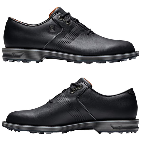 A pair of black golf shoes is displayed side by side showcasing their sleek leather design with a low profile and textured details on the upper and sole designed for traction.