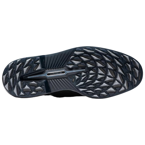 A shoe sole features a textured rubber bottom designed for traction. It displays a series of triangular patterns for grip, reflecting a functional outdoor or athletic context.