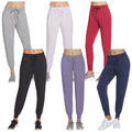 Six pairs of jogger pants in various colors are displayed. Each pair is shown on a mannequin waist-up, with drawstrings at the waist and fitted cuffs.