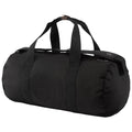 A black duffel bag sits upright with two sturdy handles on top showcasing a cylindrical shape designed for carrying various items suitable for travel or gym use.