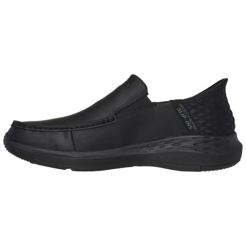 A sleek black slip-on shoe features a smooth surface and textured back, designed for comfort and casual wear, perfect for versatile settings and easy on-off use.