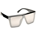 Oversized gray sunglasses with a black frame rest at an angle against a flat surface showcasing a minimalist design without additional embellishments in a bright context emphasizing their stylish appeal.