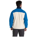 A person is wearing a blue and cream fleece jacket with a textured fabric facing away from the viewer in a neutral setting likely indoors or outdoors.