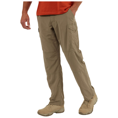 Khaki cargo pants are worn by a person standing with one hand in their pocket while wearing light brown footwear and an orange shirt against a plain white background.