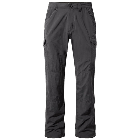 Dark gray cargo pants are displayed standing upright featuring multiple pockets and a relaxed fit designed for outdoor activities in a casual setting.