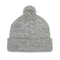 A gray knitted beanie with a pom-pom on top rests flat against a neutral background showcasing its soft texture and rolled cuff designed for warmth and style.