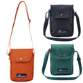 Three small shoulder bags are displayed in orange green and dark blue each with a flap closure and an adjustable strap against a plain background showcasing their simple functional design.