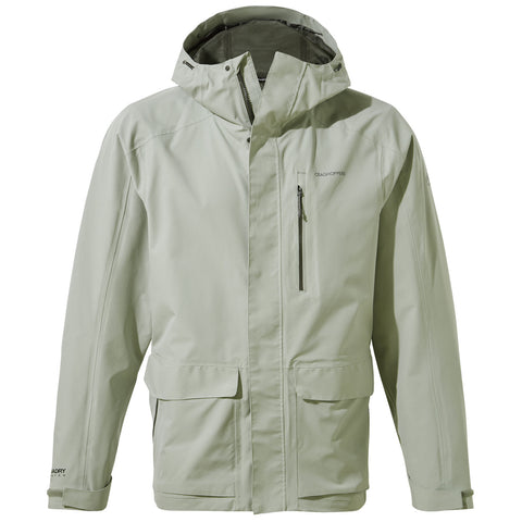 A light green waterproof jacket features a hood and zippered front pockets, designed for outdoor activities in wet weather, presented against a neutral background.