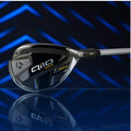 A golf club head is showcased at an angle with the brand name Q10 MAX and the word RESCUE visible on its glossy surface reflecting light against a dark background with blue diagonal lines.