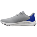 A light grey athletic shoe with a blue accent is displayed from the side showing its sleek design and textured surface intended for running or casual wear on various surfaces.